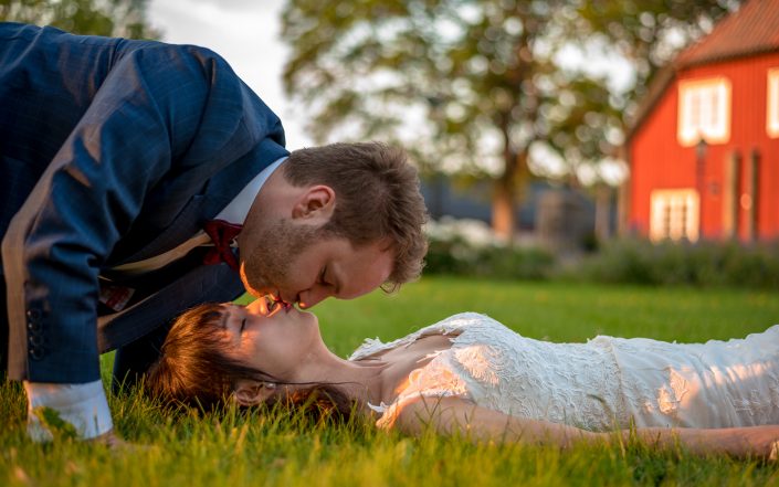 A romantic kiss during a wedding sunset photo session