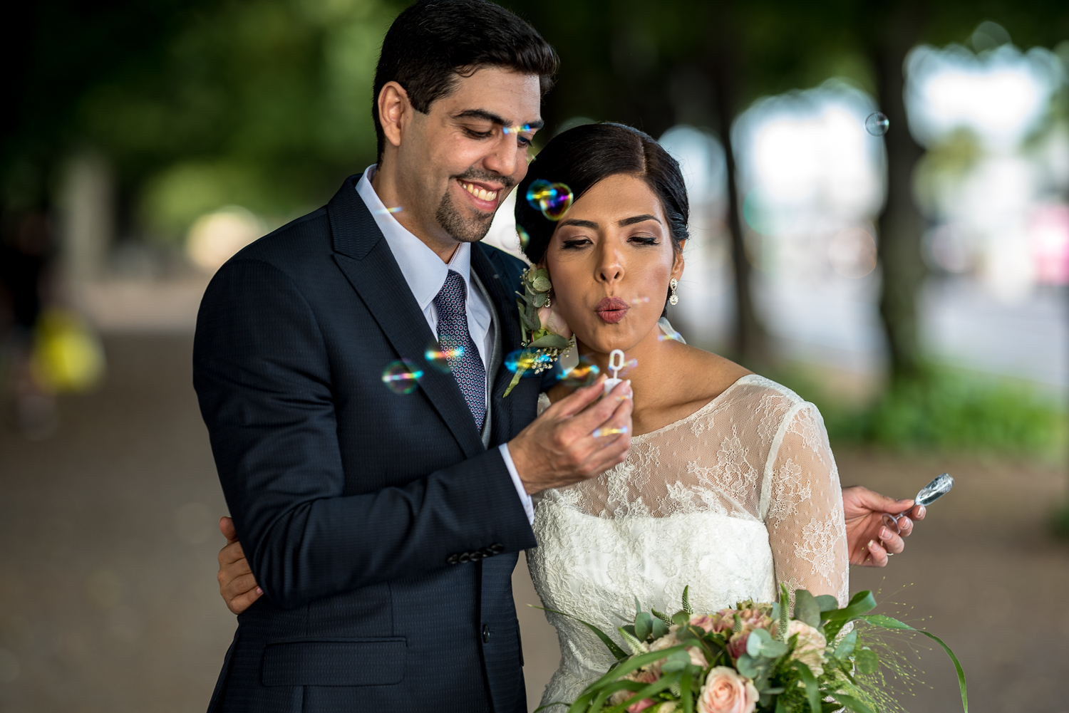 Playing with bubbles on wedding photo sessionin Stockholm